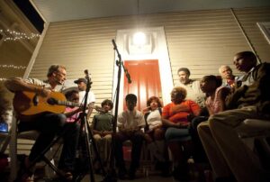 Larry Long singing in New Orleans with a group of people